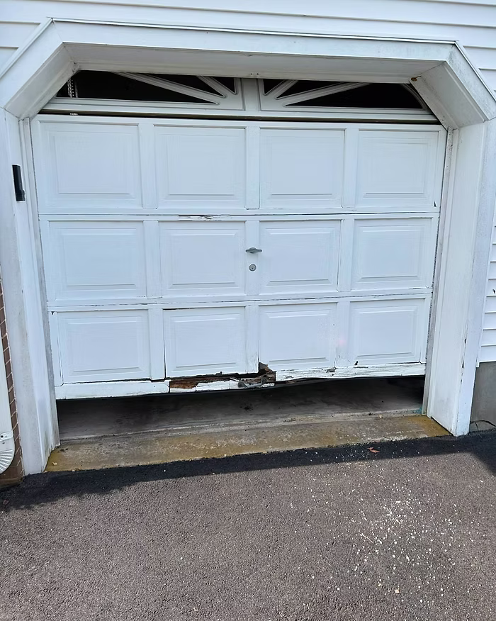 garage door in need of replacement by Surfside Garage Doors in Ocean County, New Jersey