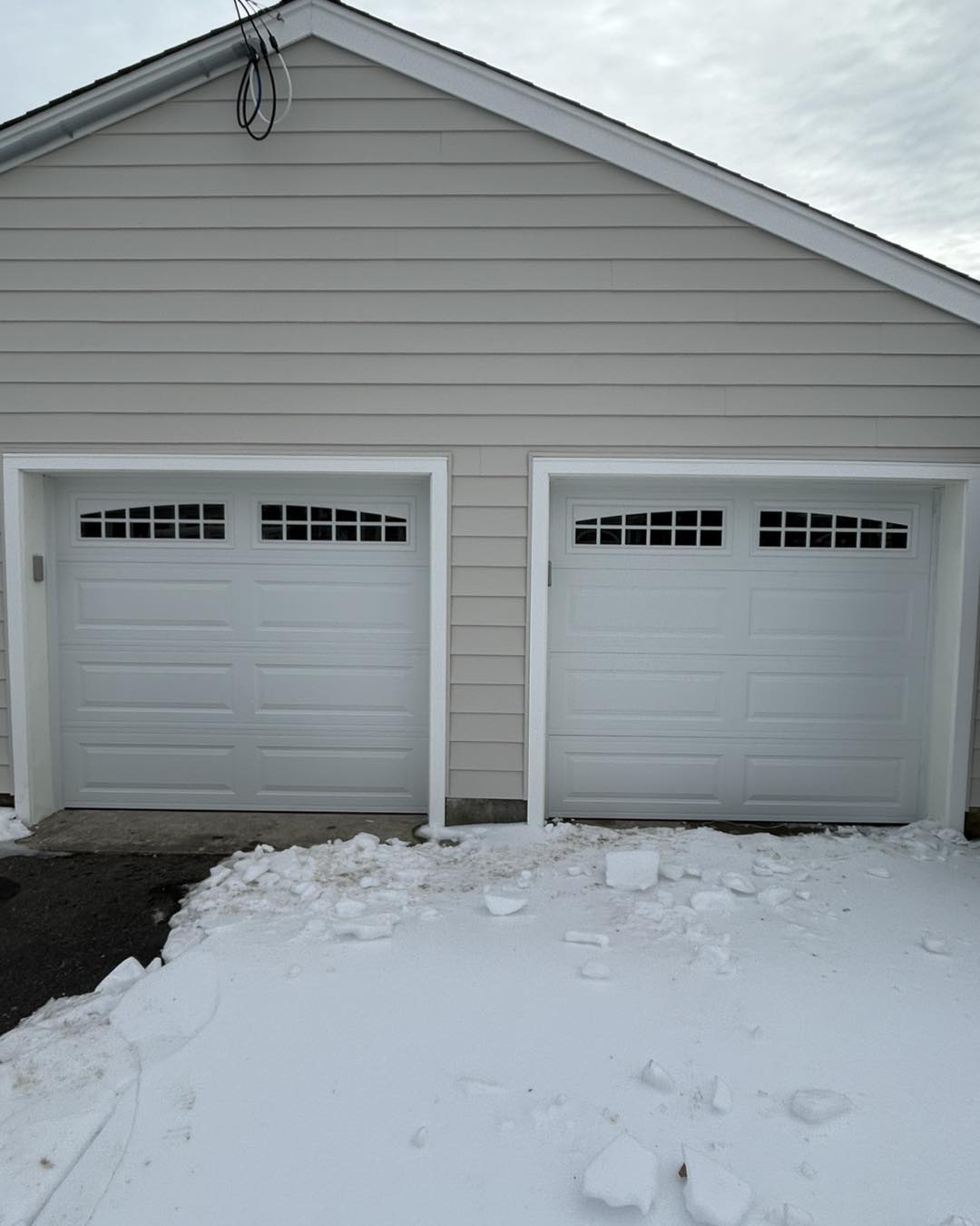 New Amarr Olympus R-19 insulated white garage doors installed in Point Pleasant NJ by Surfside Garage Doors during winter