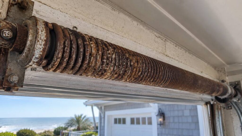 Rust and corrosion on a garage door spring caused by salt air in New Jersey