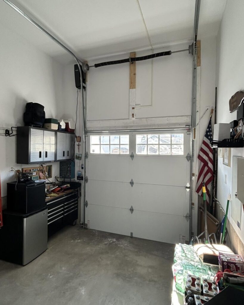 Garage door converted to high-lift track with a LiftMaster wall-mount opener in Lavallette, NJ